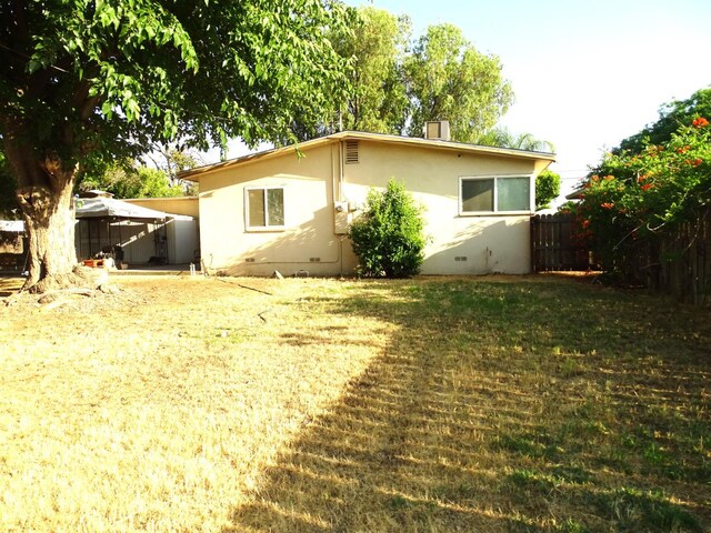 4457 E Brown Ave, Fresno, CA 93703 - rear view of property with stucco siding and a gazebo