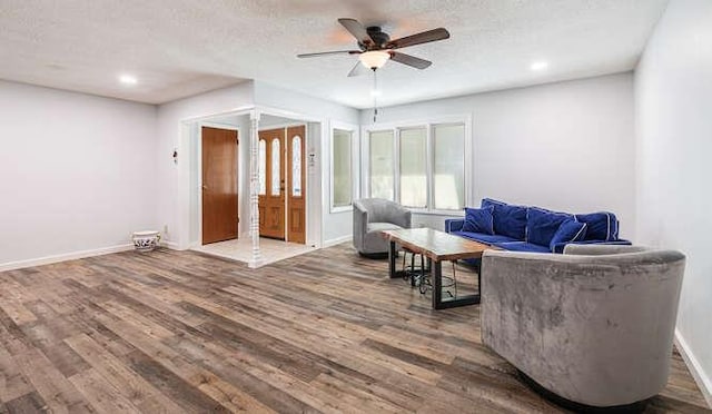 6224 N 3rd St, Fresno, CA 93710 - living room with wood finished floors, a ceiling fan, french doors, a textured ceiling, and recessed lighting