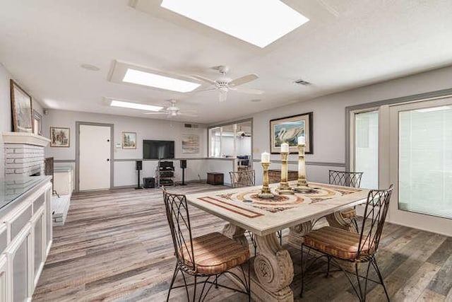 6224 N 3rd St, Fresno, CA 93710 - dining area with a skylight, light wood-style flooring, and ceiling fan