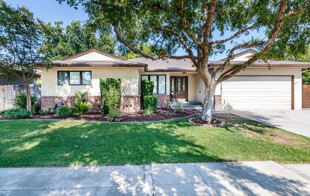 6224 N 3rd St, Fresno, CA 93710 - ranch-style house featuring brick siding, an attached garage, driveway, and a front yard