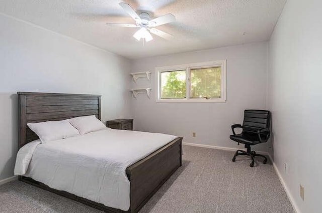 6224 N 3rd St, Fresno, CA 93710 - carpeted bedroom with a textured ceiling and a ceiling fan