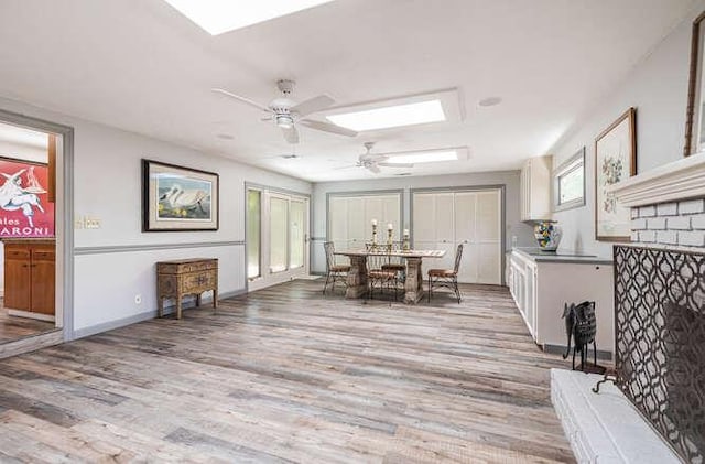 6224 N 3rd St, Fresno, CA 93710 - dining room with a skylight, light wood-style flooring, and ceiling fan