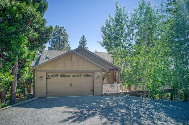 40753 Wild Iris Ln, Shaver Lake, CA 93664 - view of front facade with an attached garage and driveway