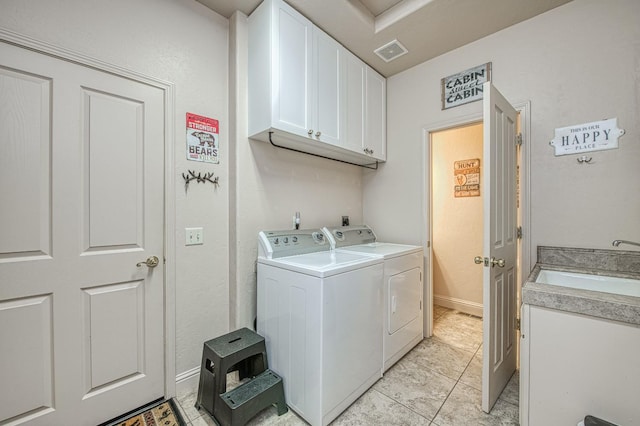 40753 Wild Iris Ln, Shaver Lake, CA 93664 - laundry room featuring cabinet space, washing machine and clothes dryer, and light tile patterned floors