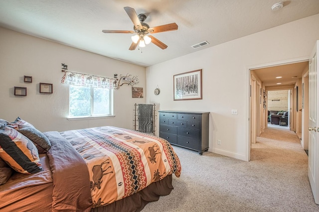 40753 Wild Iris Ln, Shaver Lake, CA 93664 - bedroom with light carpet, baseboards, and a ceiling fan