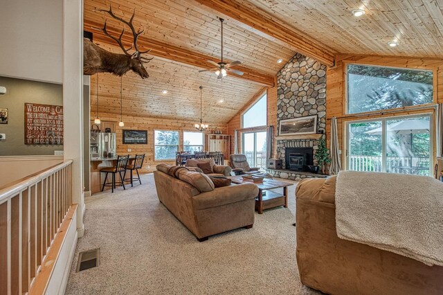 40753 Wild Iris Ln, Shaver Lake, CA 93664 - carpeted living room featuring high vaulted ceiling, ceiling fan, wood ceiling with exposed beams, a fireplace, and recessed lighting