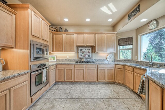 40753 Wild Iris Ln, Shaver Lake, CA 93664 - kitchen featuring stainless steel appliances, a sink, light brown cabinets, light stone countertops, and recessed lighting