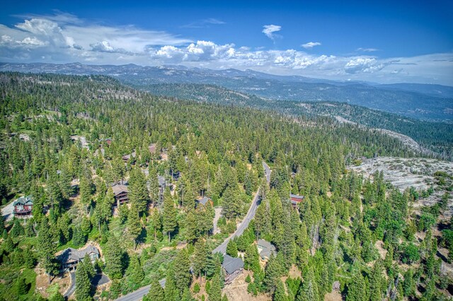 40753 Wild Iris Ln, Shaver Lake, CA 93664 - aerial view of property and surrounding area with a heavily wooded area and a mountain backdrop