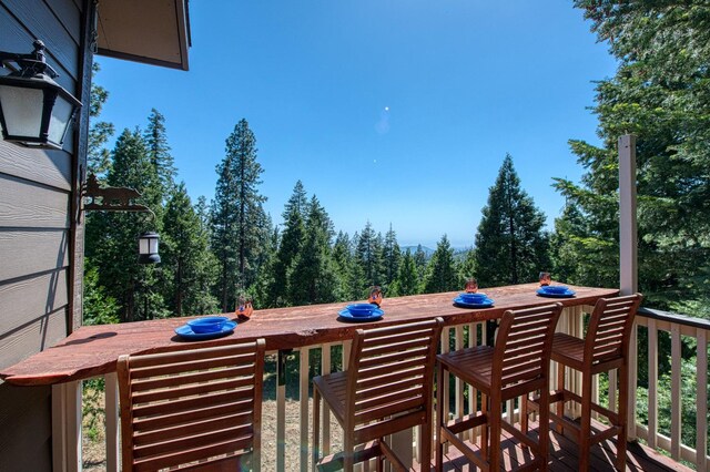 40753 Wild Iris Ln, Shaver Lake, CA 93664 - wooden terrace with outdoor dining area