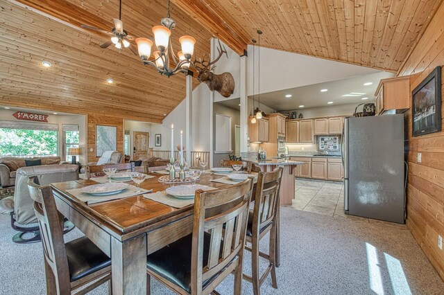 40753 Wild Iris Ln, Shaver Lake, CA 93664 - dining space with wood ceiling with exposed beams, high vaulted ceiling, a chandelier, light colored carpet, and recessed lighting