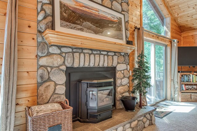 40753 Wild Iris Ln, Shaver Lake, CA 93664 - detailed view of a wood stove, carpet, wooden ceiling, and wooden walls