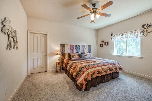 40753 Wild Iris Ln, Shaver Lake, CA 93664 - bedroom featuring light colored carpet, baseboards, and a ceiling fan