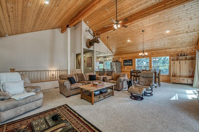 40753 Wild Iris Ln, Shaver Lake, CA 93664 - carpeted living area with ceiling fan, a chandelier, wood ceiling with exposed beams, high vaulted ceiling, and wood walls