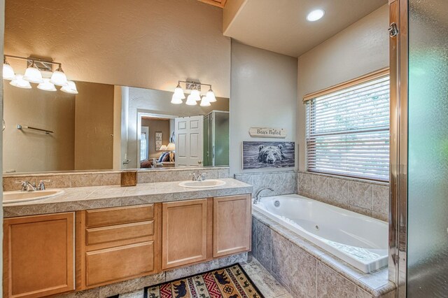40753 Wild Iris Ln, Shaver Lake, CA 93664 - bathroom featuring a whirlpool tub, double vanity, and a shower with door