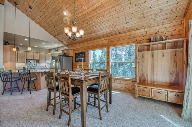 40753 Wild Iris Ln, Shaver Lake, CA 93664 - dining area with a chandelier, light colored carpet, high vaulted ceiling, wooden walls, and wooden ceiling