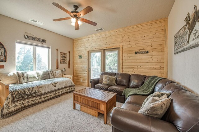 40753 Wild Iris Ln, Shaver Lake, CA 93664 - living room featuring ceiling fan, healthy amount of natural light, and carpet flooring