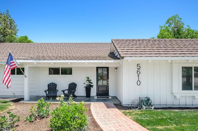 5610 N Arthur Ave, Fresno, CA 93711 - doorway to property featuring board and batten siding