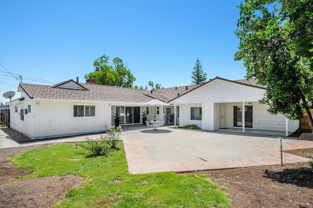 5610 N Arthur Ave, Fresno, CA 93711 - rear view of property featuring a patio area and a chimney