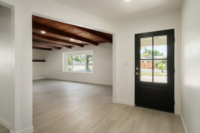 5610 N Arthur Ave, Fresno, CA 93711 - foyer with light wood-style floors, healthy amount of natural light, and a wooden ceiling with exposed beams