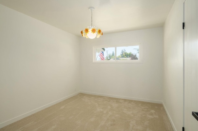 5610 N Arthur Ave, Fresno, CA 93711 - unfurnished room with a chandelier and light carpet