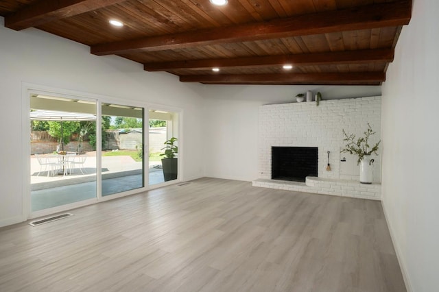 5610 N Arthur Ave, Fresno, CA 93711 - unfurnished living room with wood finished floors, a brick fireplace, a wood ceiling with exposed beams, and recessed lighting