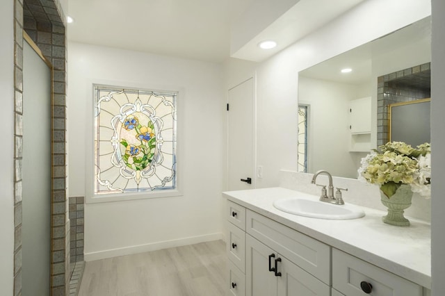 5610 N Arthur Ave, Fresno, CA 93711 - full bath featuring wood finished floors, vanity, a shower, and recessed lighting