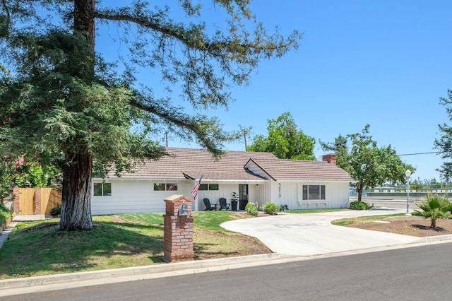5610 N Arthur Ave, Fresno, CA 93711 - ranch-style house featuring a chimney and concrete driveway