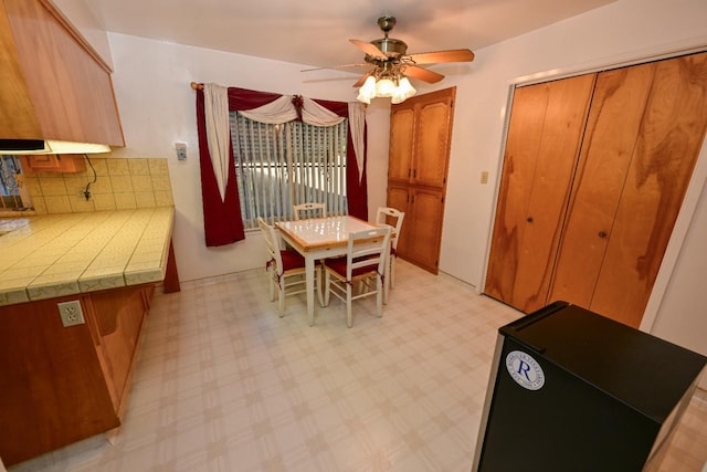 1911 W Simpson Ave, Fresno, CA 93705 - dining room with a ceiling fan and light floors