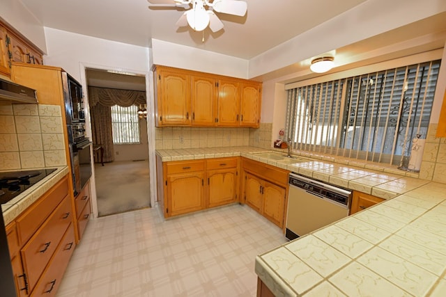 1911 W Simpson Ave, Fresno, CA 93705 - kitchen featuring black appliances, a ceiling fan, a sink, tasteful backsplash, and range hood