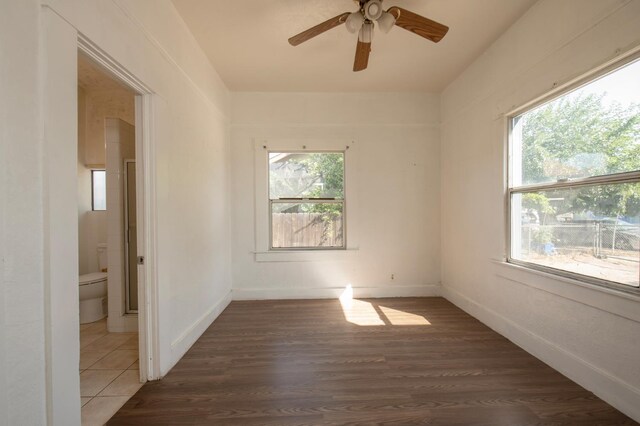 208 N 5th St, Fowler, CA 93625 - empty room with a ceiling fan, wood finished floors, and baseboards