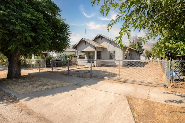 208 N 5th St, Fowler, CA 93625 - bungalow-style home with a gate, a fenced front yard, stucco siding, and a chimney