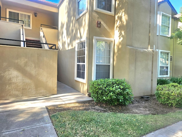 8147 N Cedar Ave Unit 115, Fresno, CA 93720 - property entrance featuring stucco siding