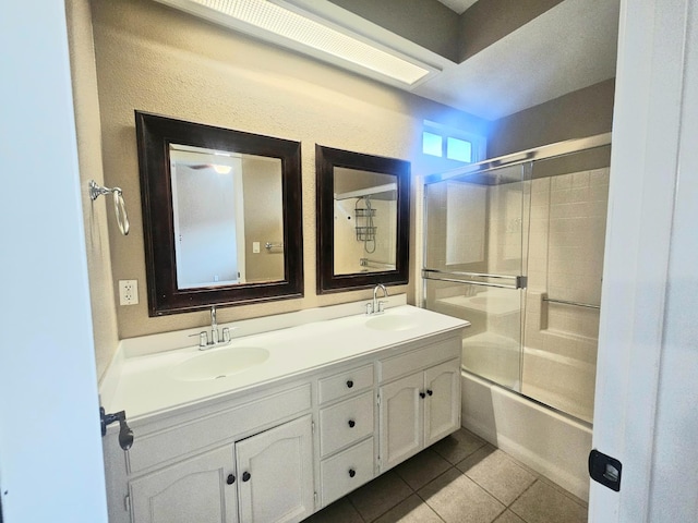 8147 N Cedar Ave Unit 115, Fresno, CA 93720 - bathroom featuring double vanity, tile patterned flooring, and enclosed tub / shower combo