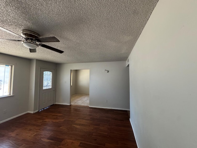 1546 W Orleans Ave, Fresno, CA 93706 - unfurnished room with plenty of natural light, a textured ceiling, wood finished floors, and ceiling fan