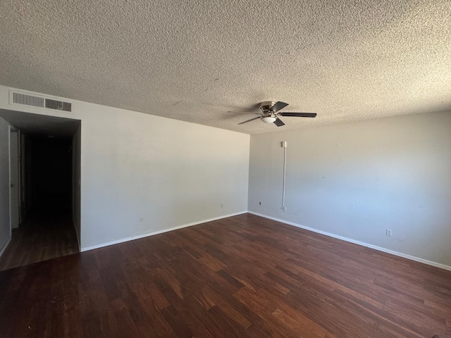 1546 W Orleans Ave, Fresno, CA 93706 - spare room featuring dark wood-style floors, ceiling fan, and a textured ceiling