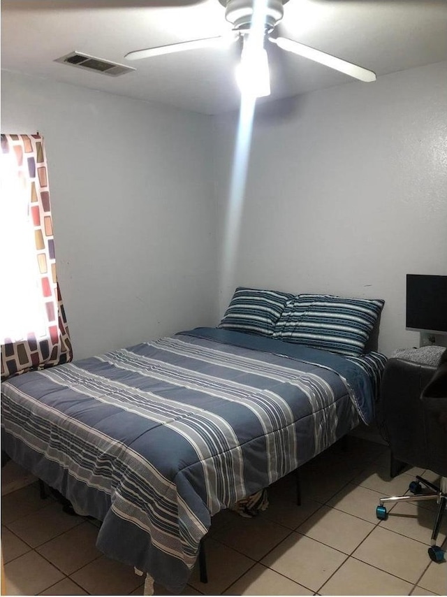 3546 N Berlin Ave, Fresno, CA 93722 - bedroom with light tile patterned floors and a ceiling fan