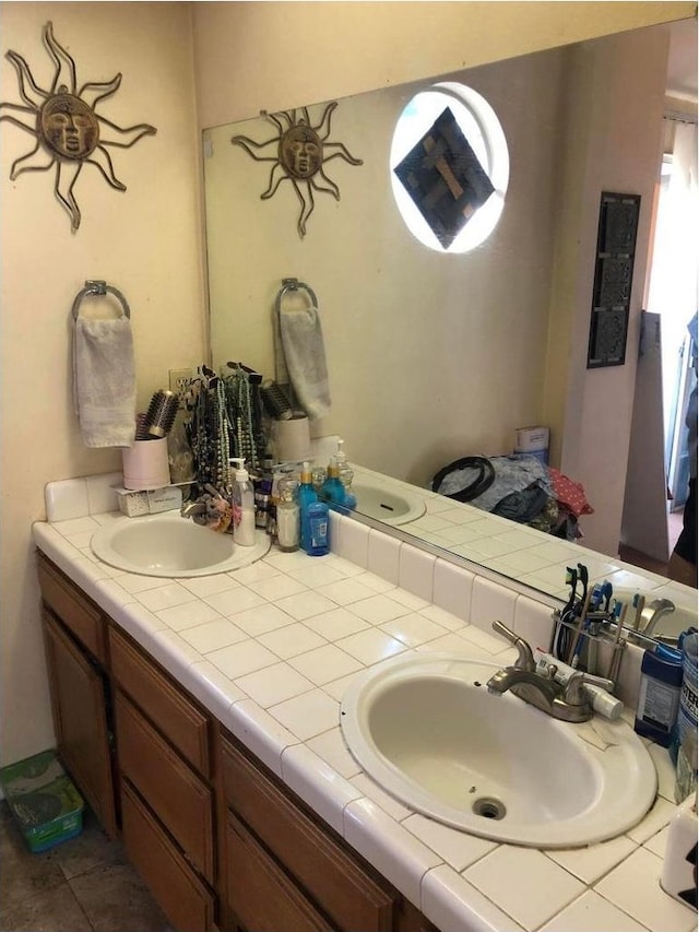 3546 N Berlin Ave, Fresno, CA 93722 - full bathroom with double vanity and tile patterned floors