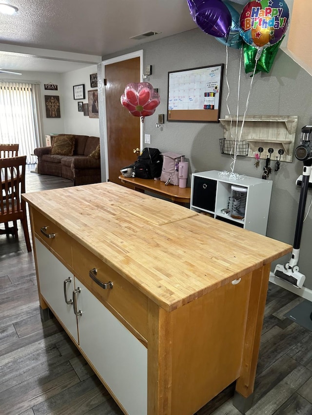 4885 N Backer Ave Unit 148, Fresno, CA 93726 - kitchen with wooden counters and dark wood finished floors