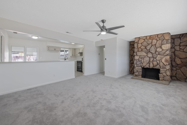955 W San Gabriel Ave, Clovis, CA 93612 - unfurnished living room with ceiling fan, a sink, light colored carpet, and baseboards