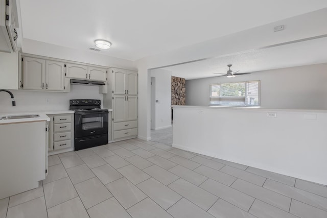 955 W San Gabriel Ave, Clovis, CA 93612 - kitchen featuring black range with electric cooktop, a sink, under cabinet range hood, ceiling fan, and light countertops