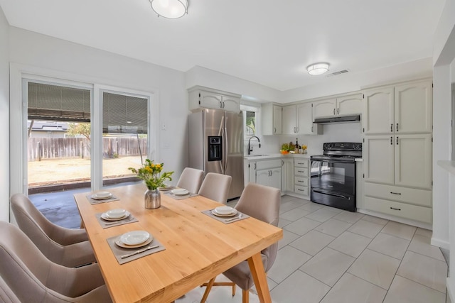 955 W San Gabriel Ave, Clovis, CA 93612 - dining area with plenty of natural light and light tile patterned floors