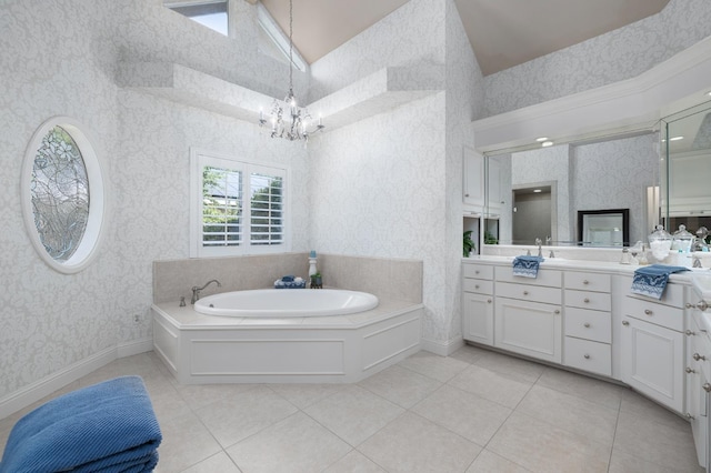 8741 E Los Altos Ave, Clovis, CA 93619 - bathroom featuring wallpapered walls, vanity, a chandelier, a bath, and a towering ceiling
