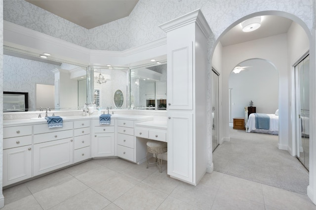 8741 E Los Altos Ave, Clovis, CA 93619 - bathroom featuring connected bathroom, wallpapered walls, double vanity, tile patterned floors, and a stall shower