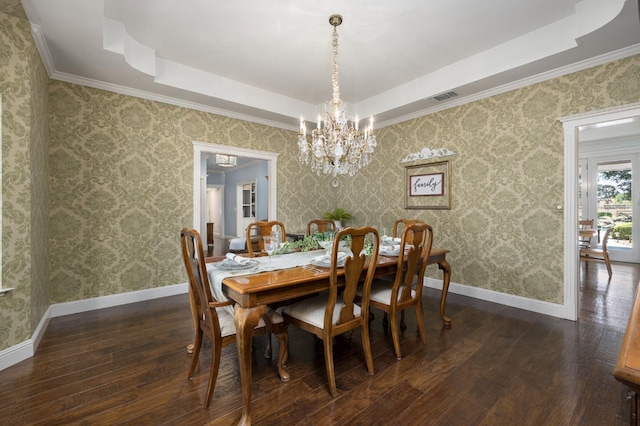 8741 E Los Altos Ave, Clovis, CA 93619 - dining room with a tray ceiling, dark wood-type flooring, a chandelier, baseboards, and ornamental molding