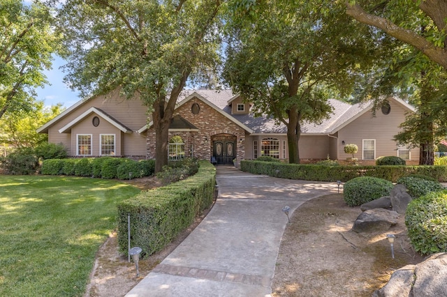 8741 E Los Altos Ave, Clovis, CA 93619 - view of front of house with a front lawn, a shingled roof, and brick siding