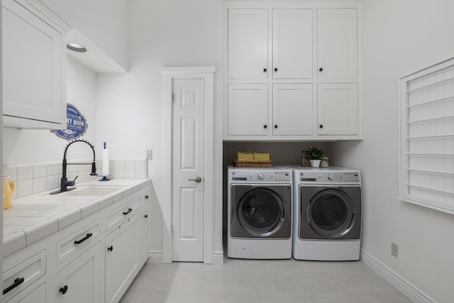 8741 E Los Altos Ave, Clovis, CA 93619 - laundry room featuring cabinet space, washer and clothes dryer, and baseboards