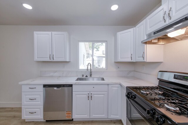 3722 N Hammel Way, Fresno, CA 93727 - kitchen featuring range with gas cooktop, stainless steel dishwasher, range hood, a sink, and light stone counters