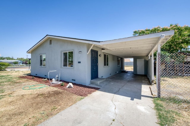 3722 N Hammel Way, Fresno, CA 93727 - view of front of home featuring crawl space, driveway, a carport, and stucco siding