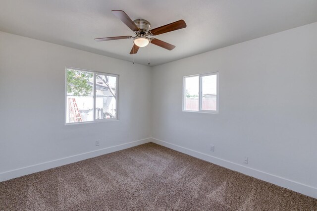 3722 N Hammel Way, Fresno, CA 93727 - carpeted empty room with plenty of natural light, baseboards, and a ceiling fan