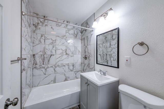 3722 N Hammel Way, Fresno, CA 93727 - bathroom featuring toilet, washtub / shower combination, and vanity